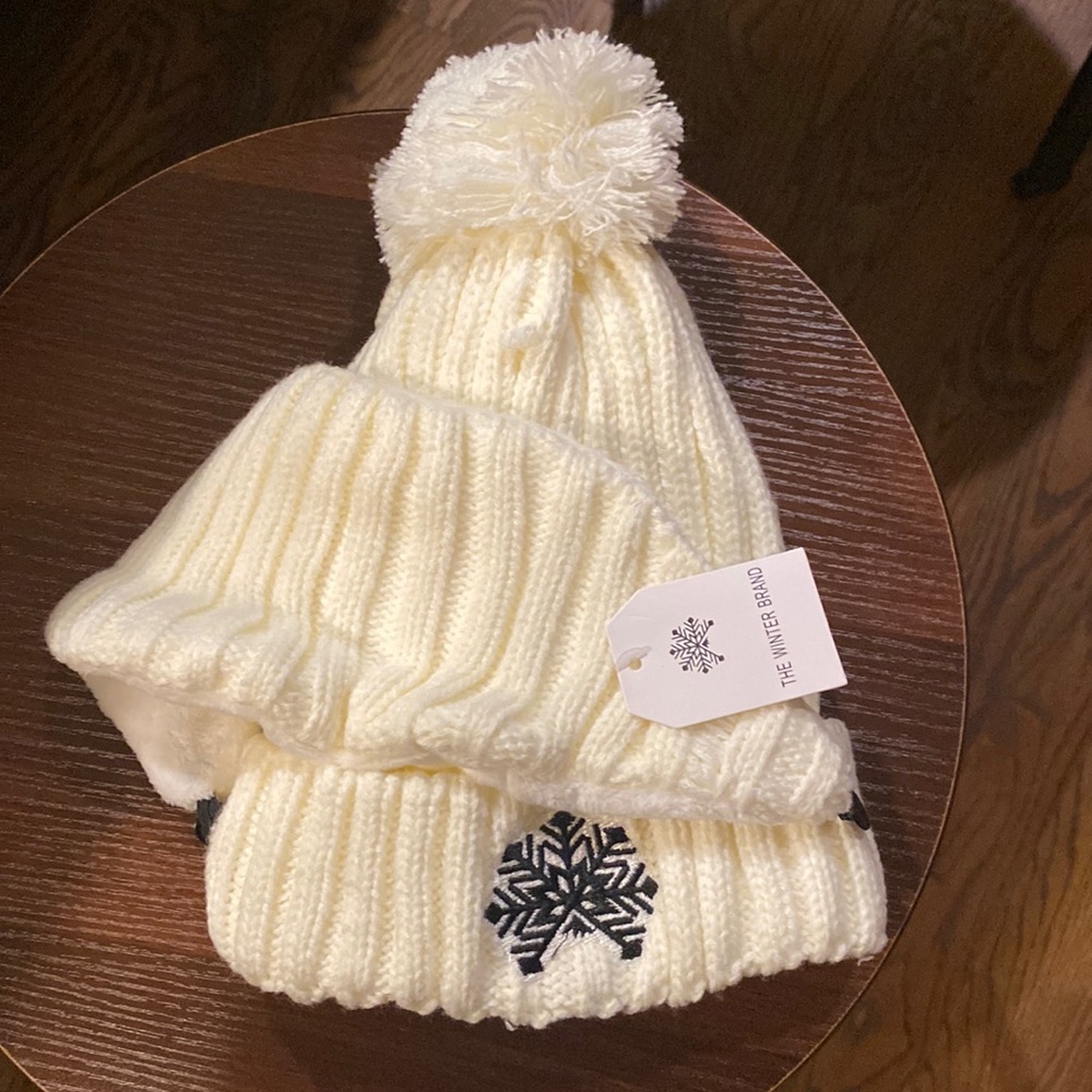 Fleece lined cream color Pom beanie with ball on top and snowflake